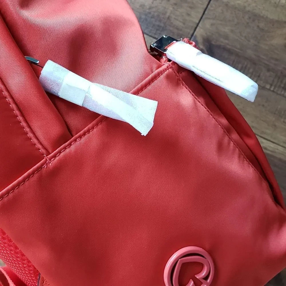 Kate Spade large orange nylon backpack